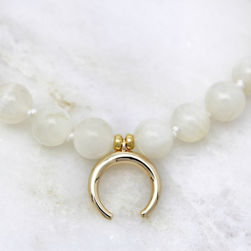 Ananda Bracelet made with moonstone and gold plated crescent moon pendant.
