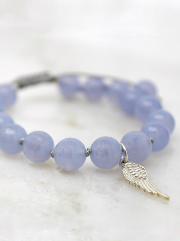 Satya Bracelet hand-knotted with 8mm Blue Laced Agate and Sterling Silver feather Wing pendant.
